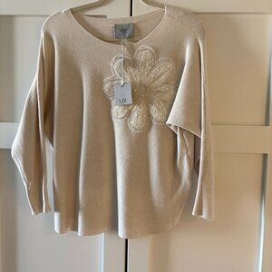Sweater with floral applique.